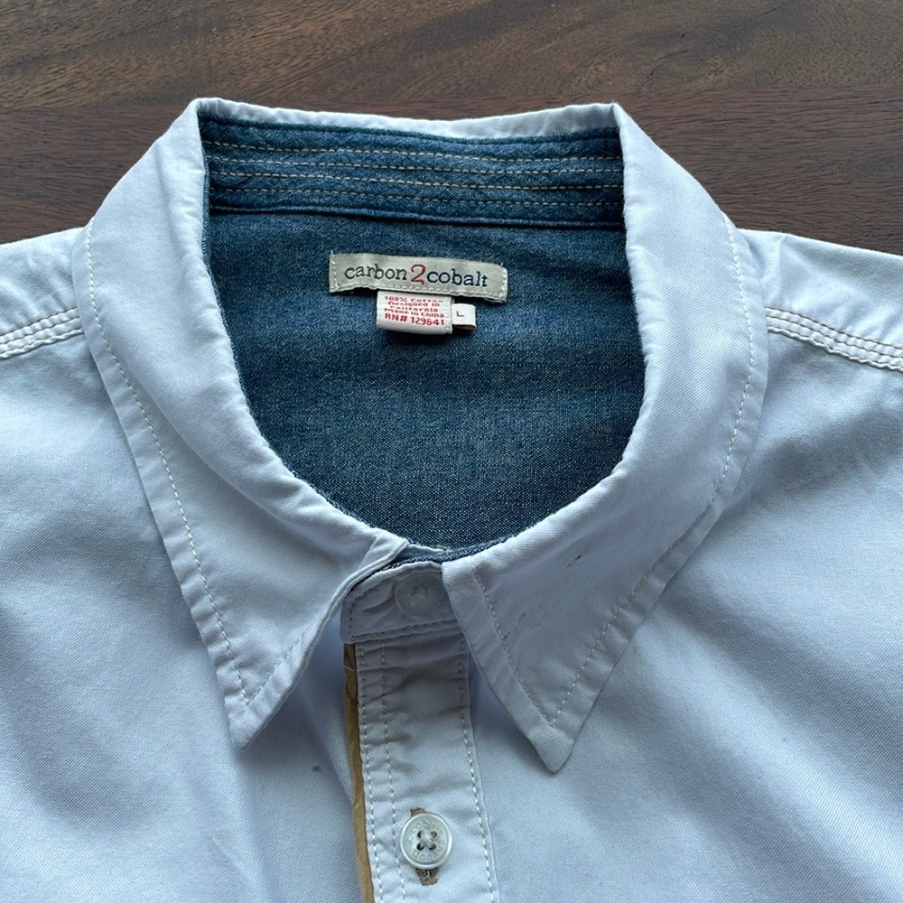 Nice white mens long sleeve shirt. Size large but it is a wide long large.